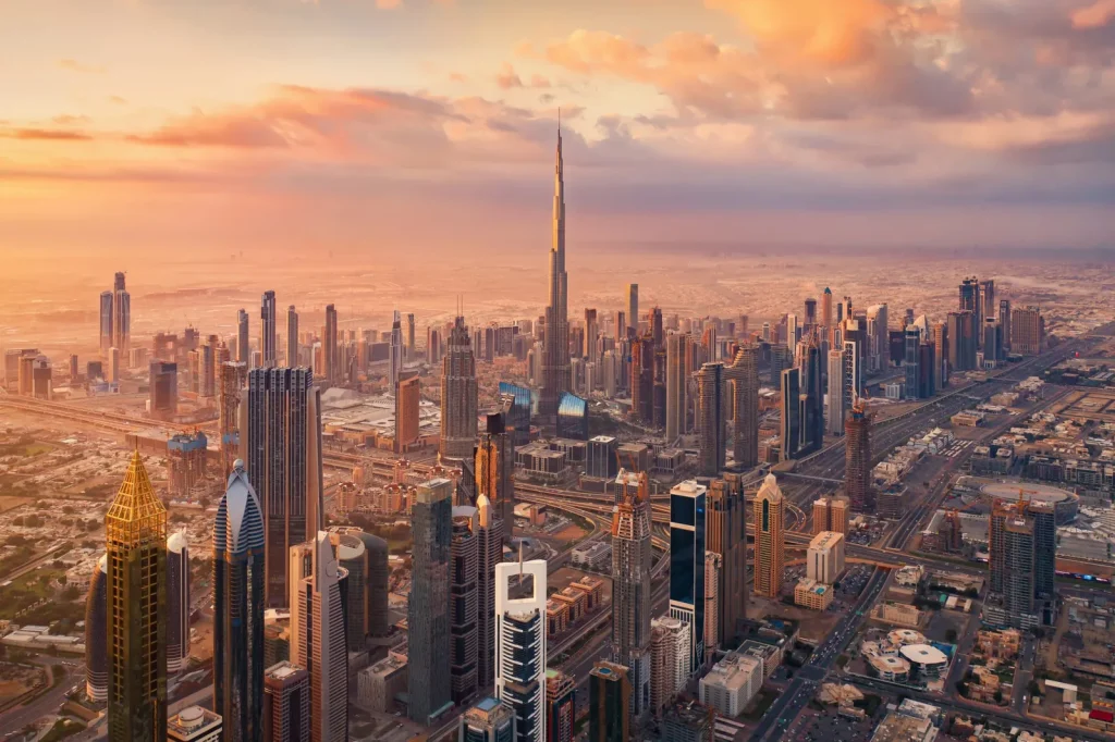 Aerial view of Dubai Downtown skyline at sunset with Burj Khalifa — best area to stay in Dubai for first-time visitors